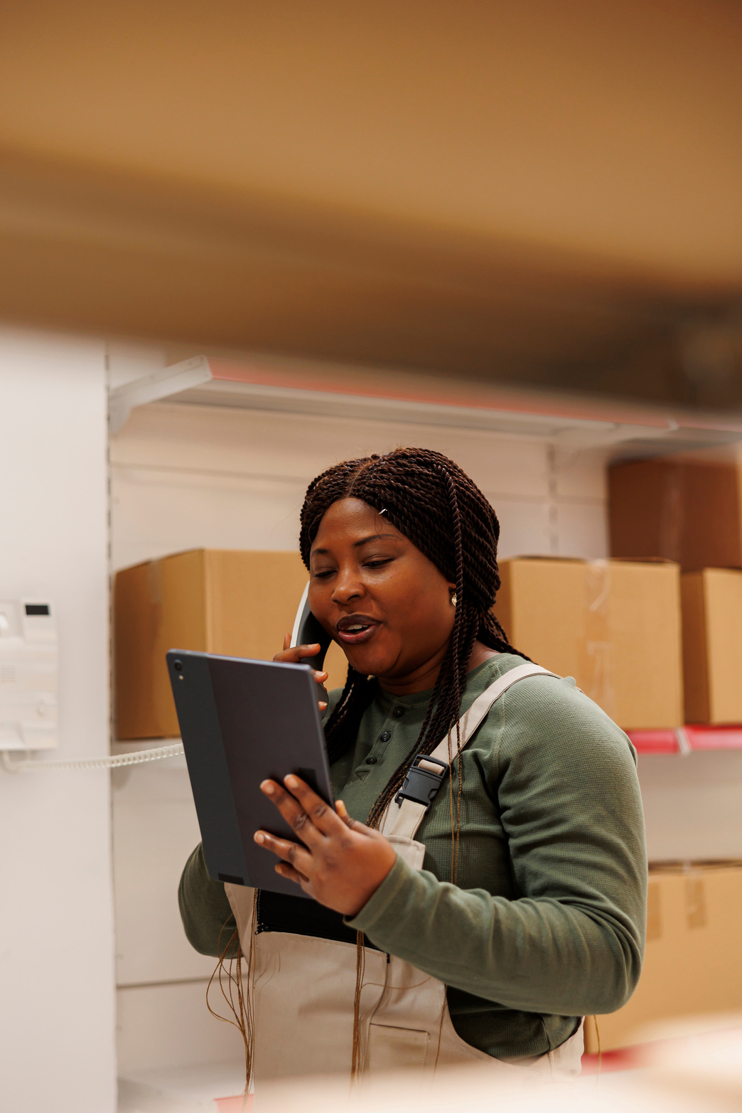 Warehouse employee discussing merchandise inventory